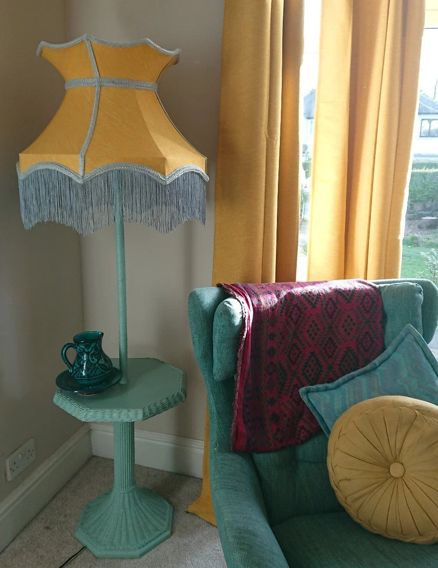 Lampshade in mustard yellow fabric in crown shape with grey trim and lining